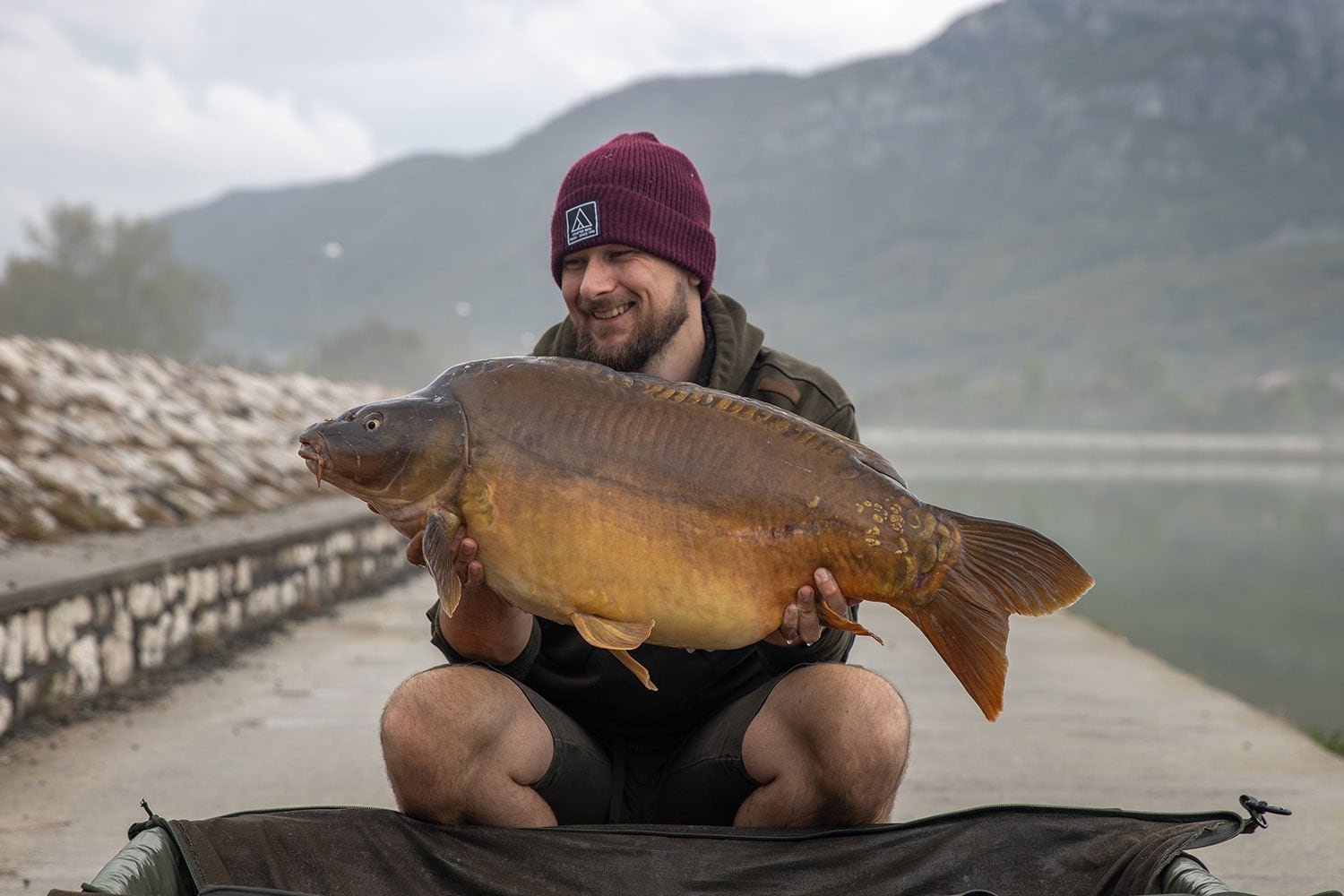 Jamie at Tribalj lake holding common carp