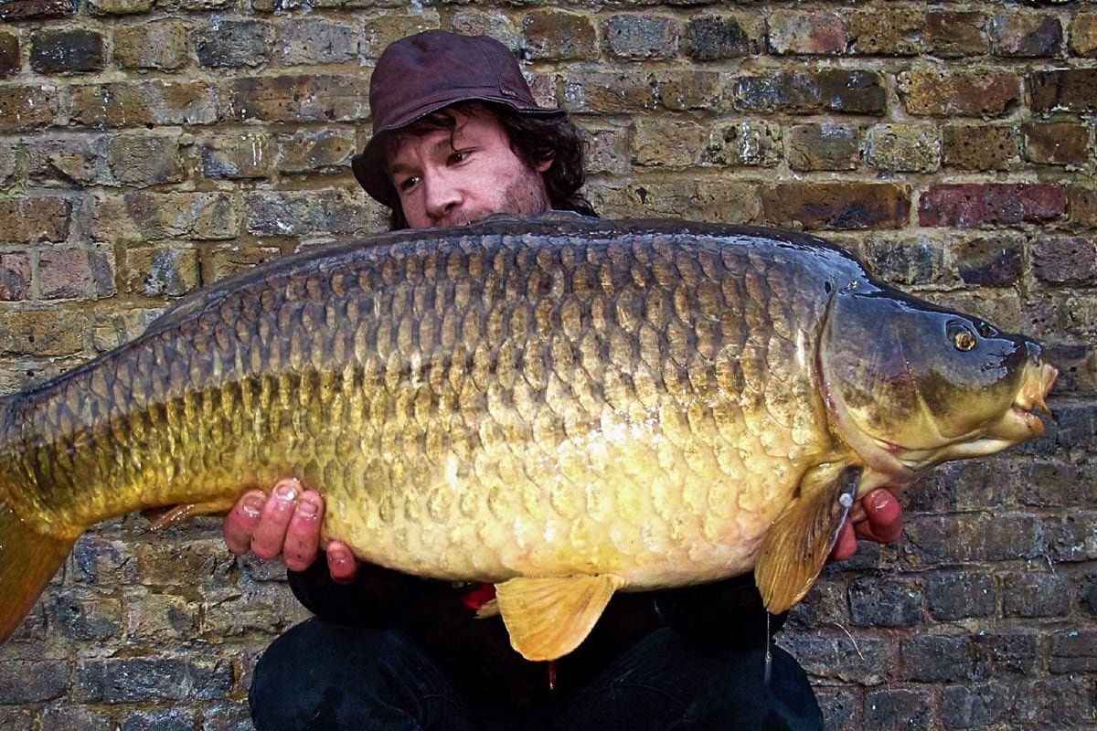 Sam holding big carp in London