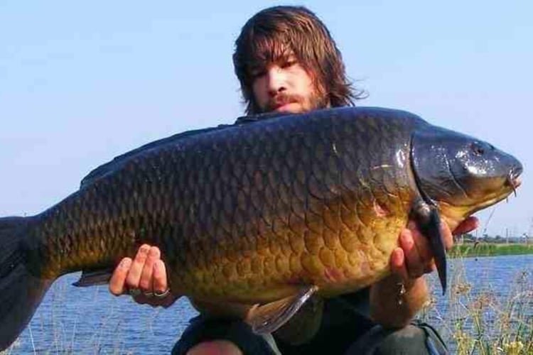 Sam holding big carp