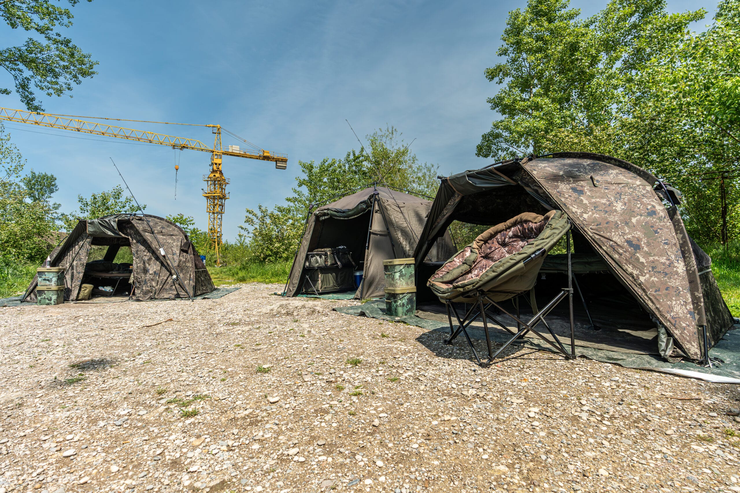 Fishing tents and crane in outdoor setting