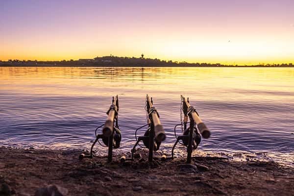 Sunset view over lake with resting cannons.